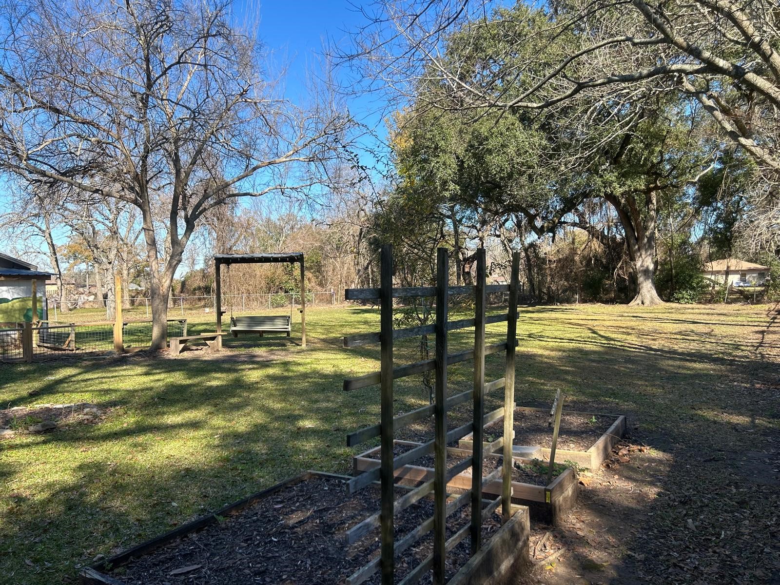 401 Billington Street Clute, TX 77531 - Photo 20 of 22 a view of yard with swimming pool and green space