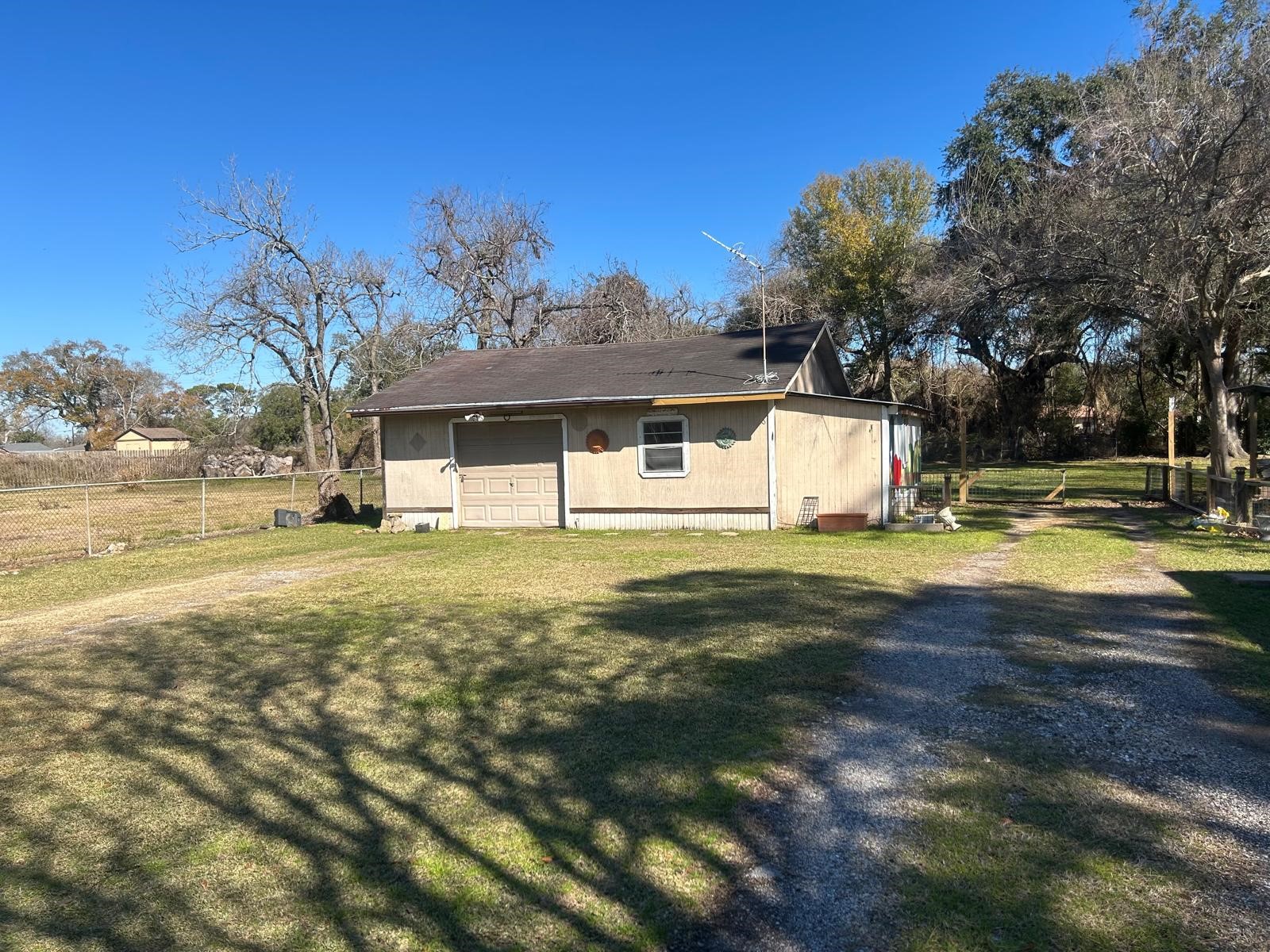 401 Billington Street Clute, TX 77531 - Photo 22 of 22 a front view of a house with a yard