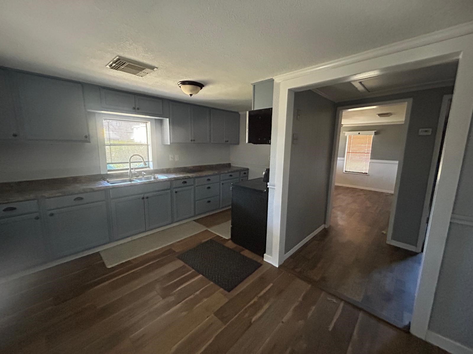 401 Billington Street Clute, TX 77531 - Photo 4 of 22 a kitchen with stainless steel appliances granite countertop a refrigerator and a sink