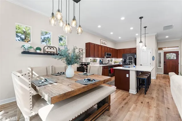 a kitchen with a table and chairs in it