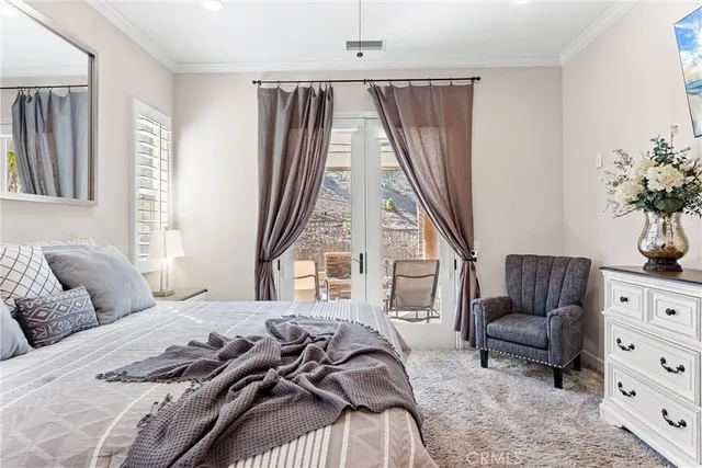 a bedroom with a bed furniture and a window