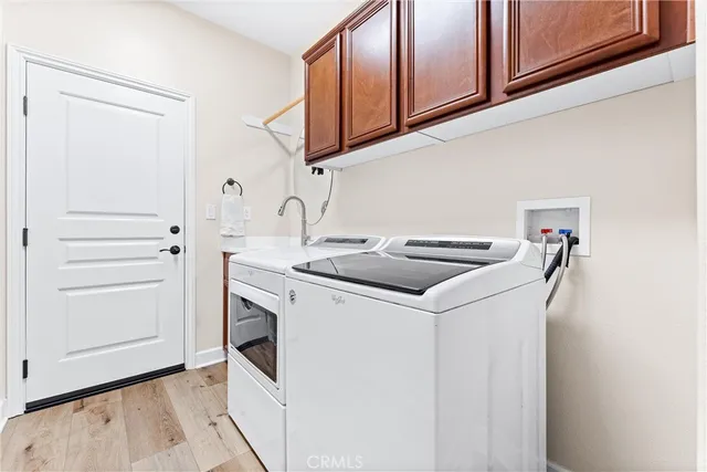 a utility room with washer and dryer