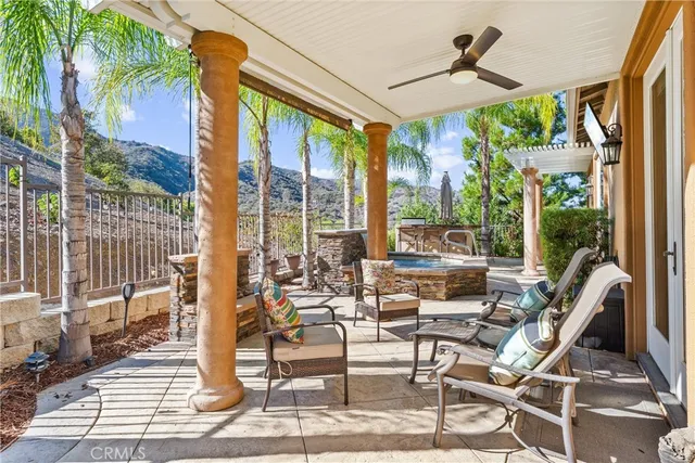 a view of a patio with a dining table and chairs