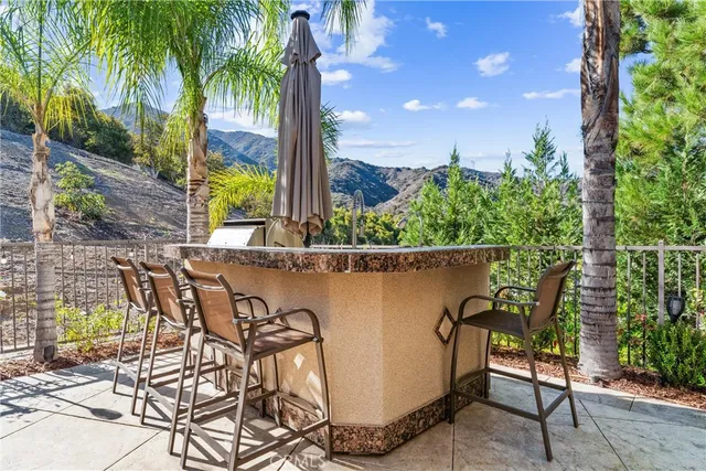 a view of a chairs and table in patio