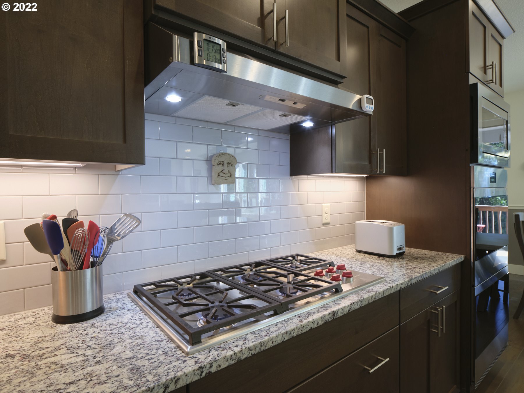 4911 South 19th Street Ridgefield, WA 98642 - Photo 11 of 26 a kitchen with stainless steel appliances granite countertop a sink stove and cabinets