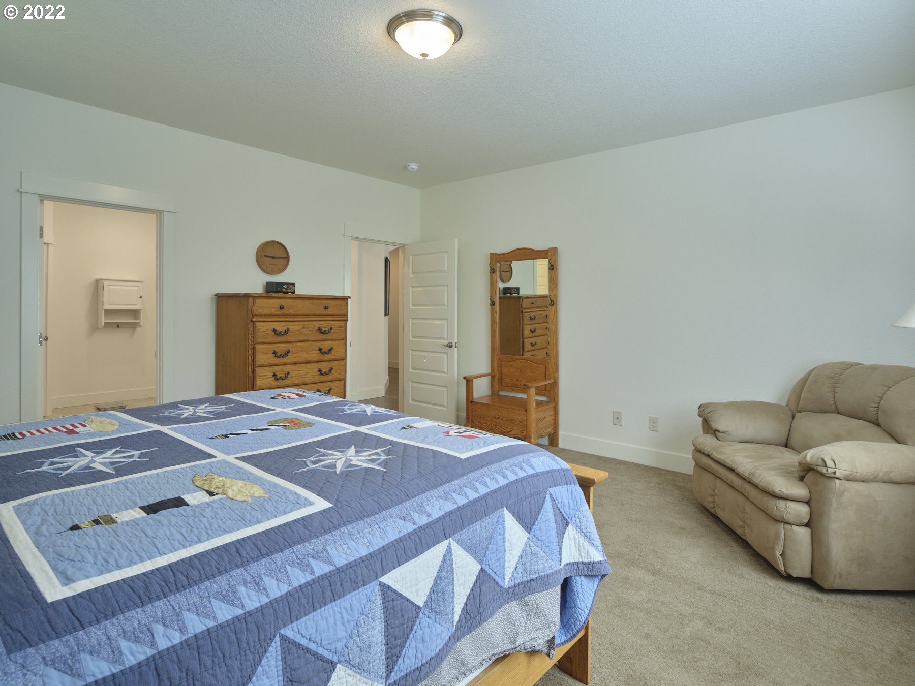 4911 South 19th Street Ridgefield, WA 98642 - Photo 19 of 26 a bedroom with a bed and a dresser