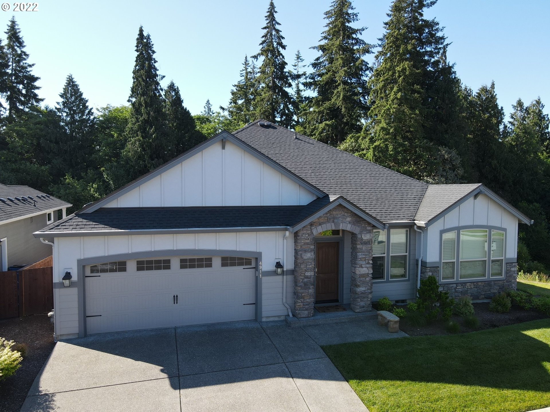 4911 South 19th Street Ridgefield, WA 98642 - Photo 2 of 26 a aerial view of a house next to a yard