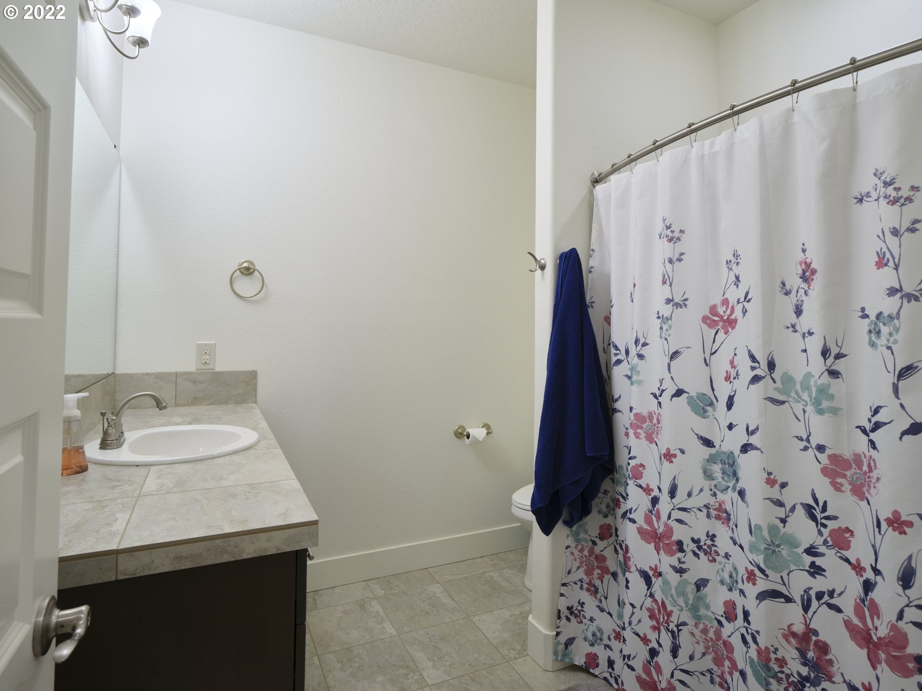4911 South 19th Street Ridgefield, WA 98642 - Photo 24 of 26 a bathroom with a sink and a mirror