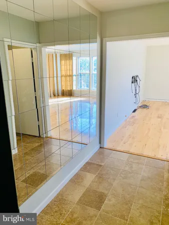 a view of a bathroom with tub and shower
