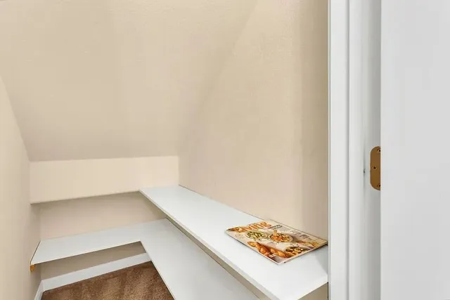 a view of kitchen island with a refrigerator
