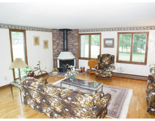 14 Middle Road Amesbury, MA 01913 - Photo 5 of 10 a living room with furniture a table and large windows