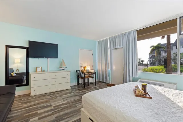 a bedroom with a bed and a dresser