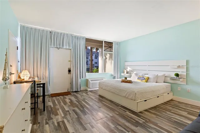 a bedroom with a bed and window