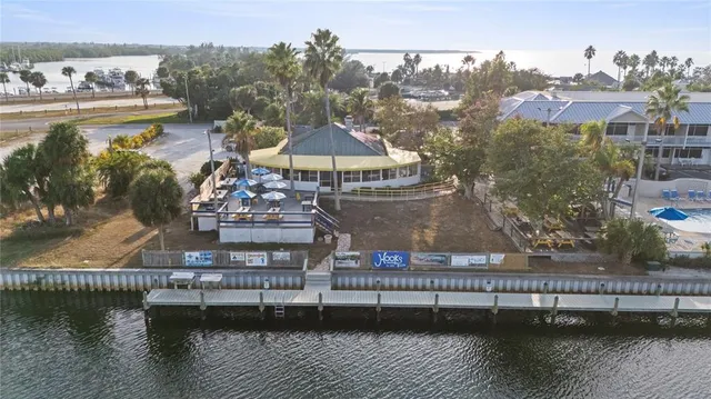 an aerial view of a house with outdoor space