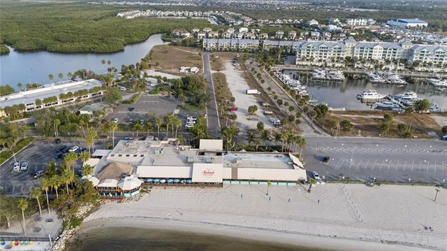 an aerial view of a house with a lake view