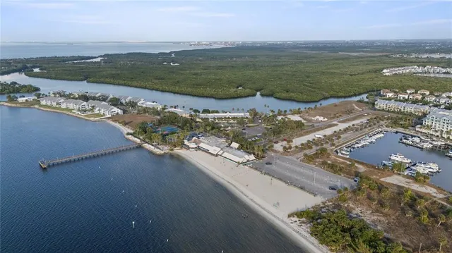 an aerial view of a house with a lake view
