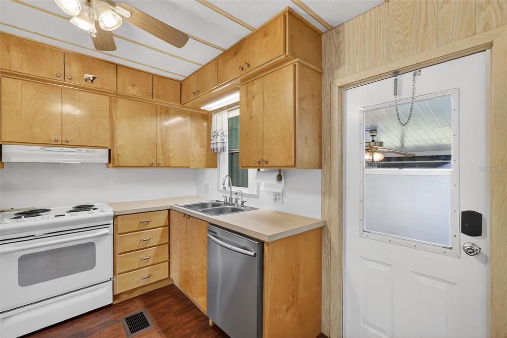 165 Shady Lane Eustis, FL 32726 - Photo 14 of 25 a kitchen with a sink stove and cabinets