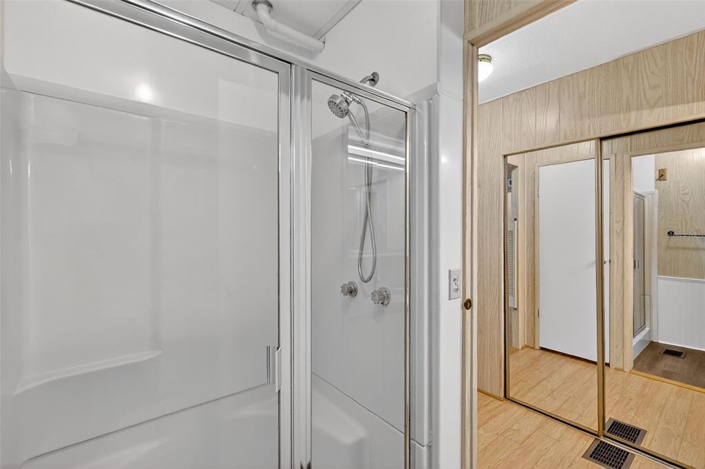 165 Shady Lane Eustis, FL 32726 - Photo 19 of 25 a bathroom with a shower and a glass door