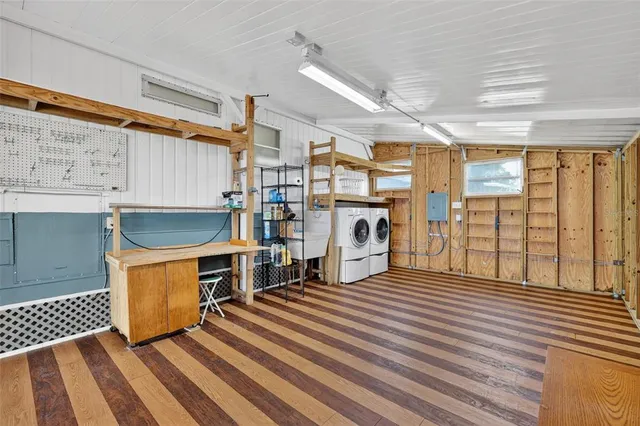 a living room with stainless steel fireplace furniture and a large window