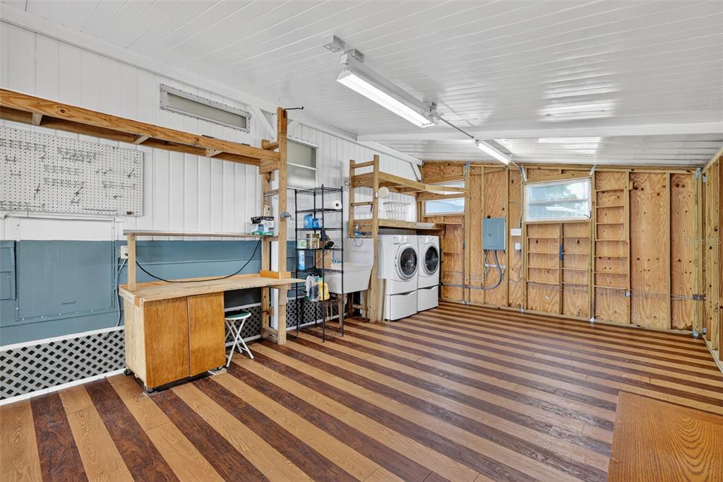 165 Shady Lane Eustis, FL 32726 - Photo 23 of 25 a living room with stainless steel fireplace furniture and a large window