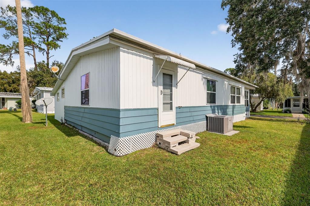 165 Shady Lane Eustis, FL 32726 - Photo 25 of 25 a backyard of a house with table and chairs
