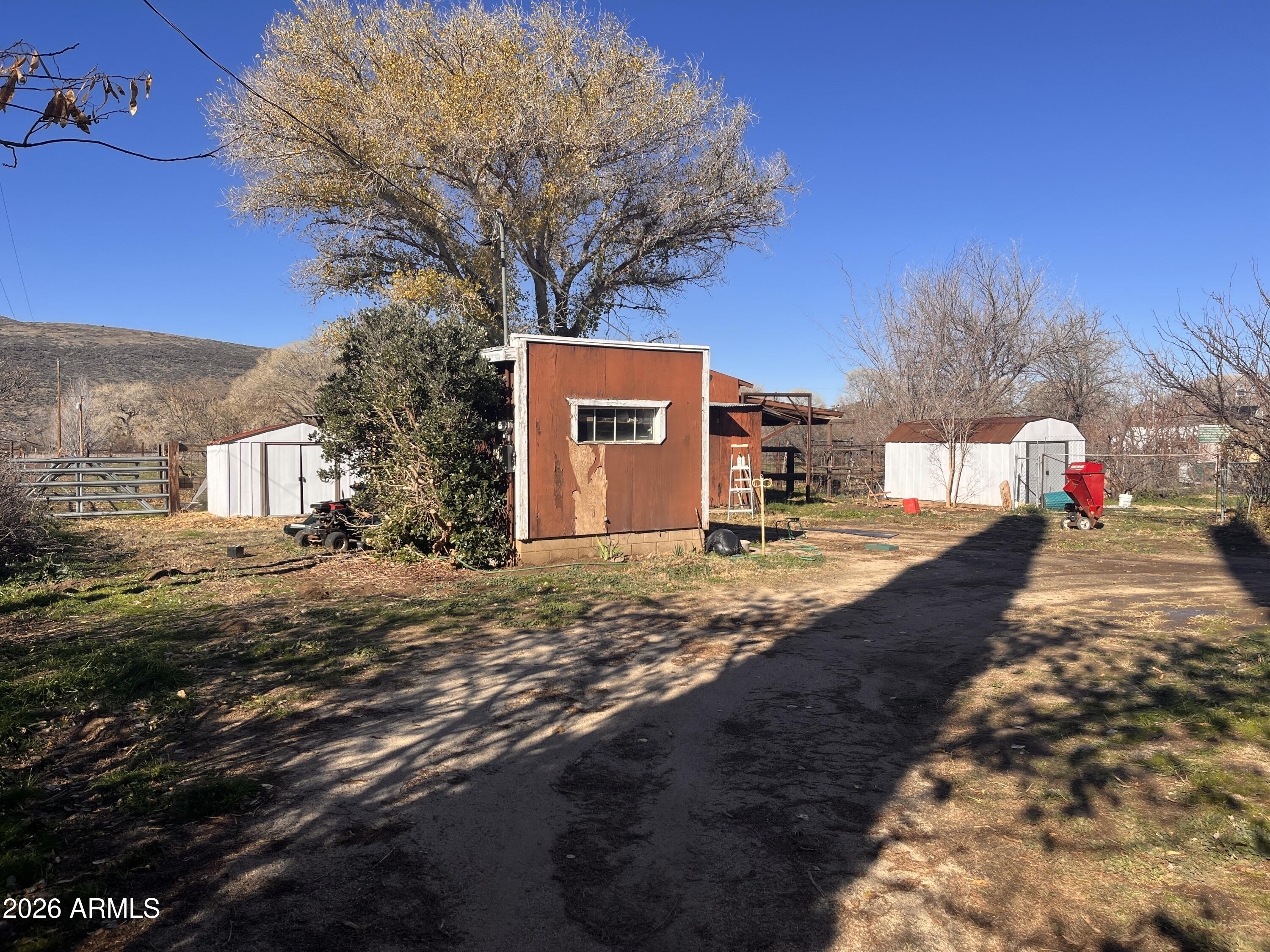 3140 Iron Springs Road Skull Valley, AZ 86338 - Photo 16 of 37 a view of a house with a yard