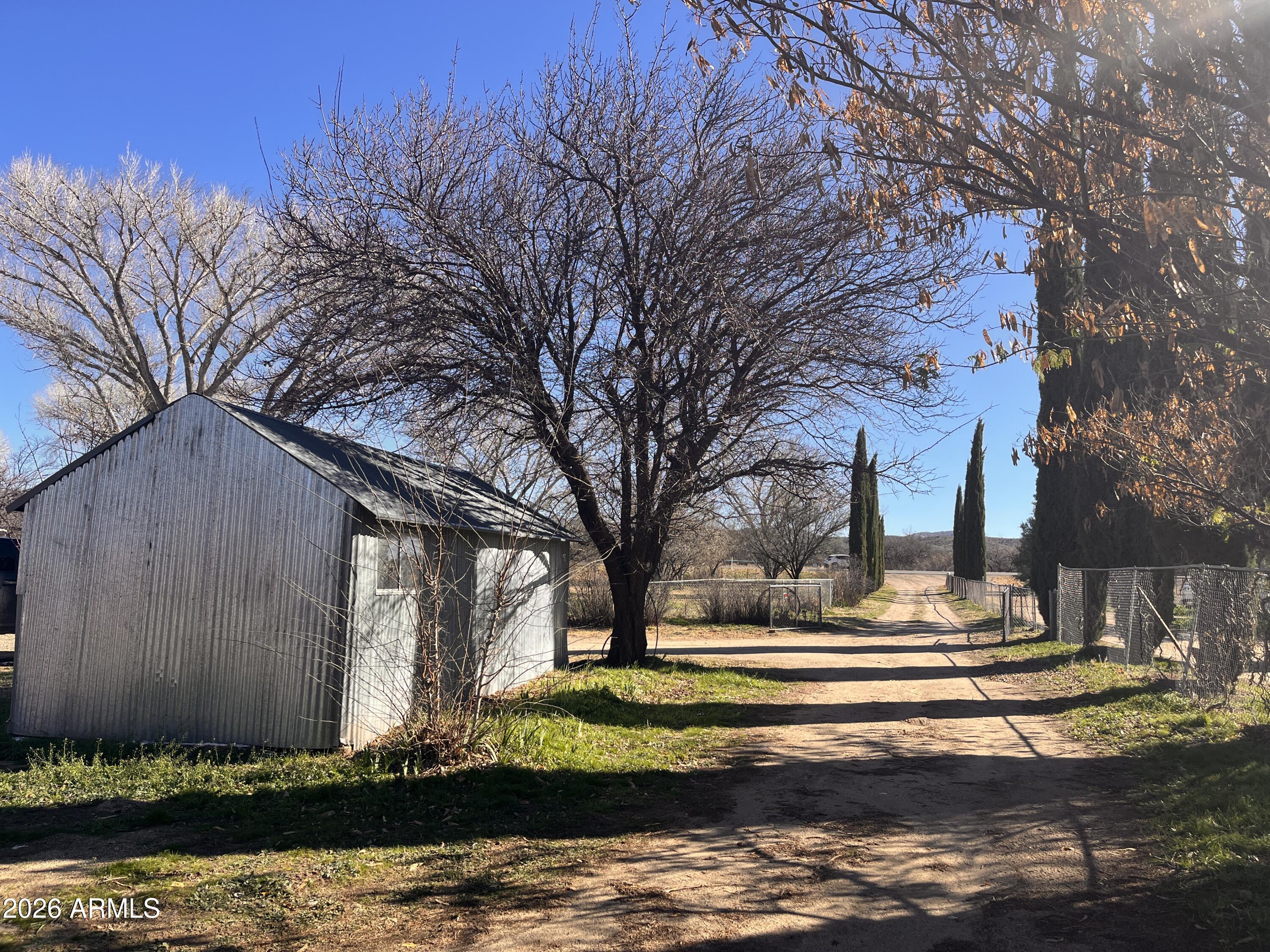 3140 Iron Springs Road Skull Valley, AZ 86338 - Photo 18 of 37 a front view of a house with a yard