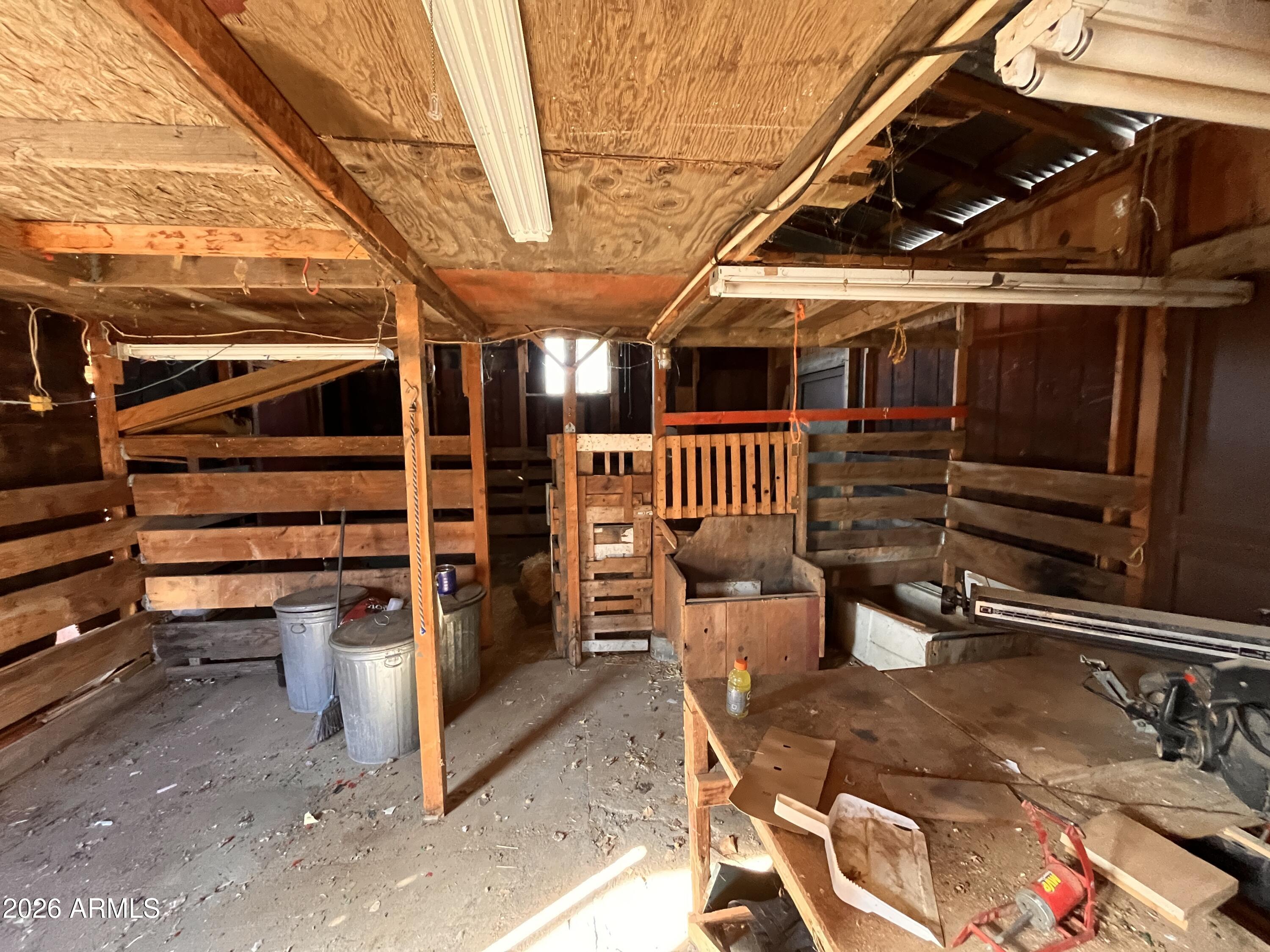 3140 Iron Springs Road Skull Valley, AZ 86338 - Photo 24 of 37 a view of a storage room with wooden walls