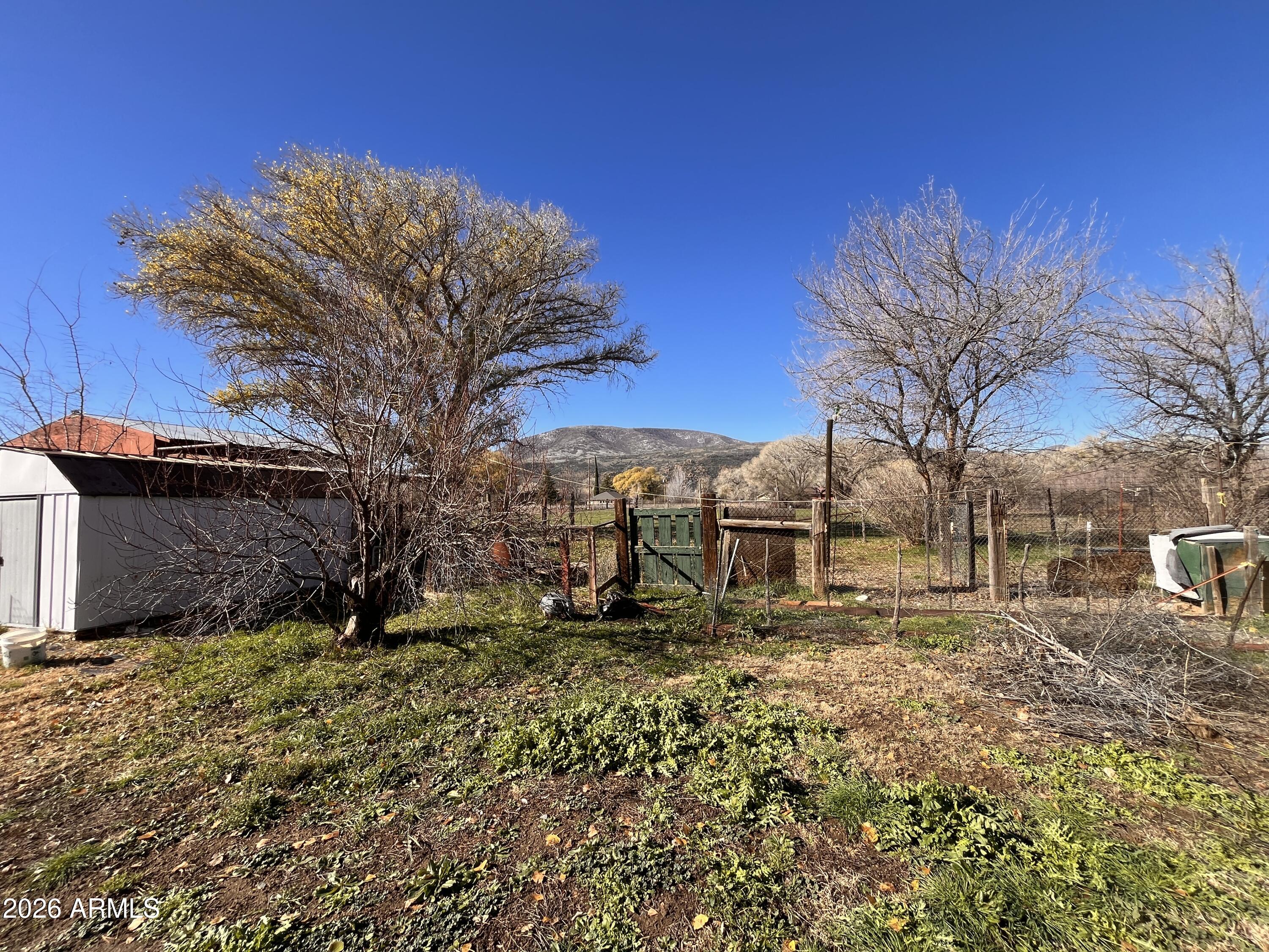 3140 Iron Springs Road Skull Valley, AZ 86338 - Photo 31 of 37 a view of a backyard with wooden fence