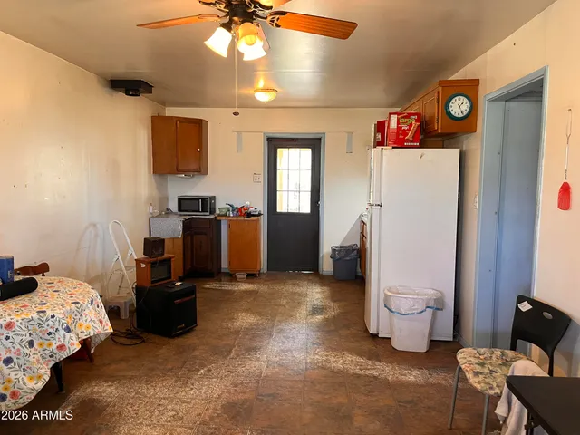 a bathroom with a toilet and a mirror