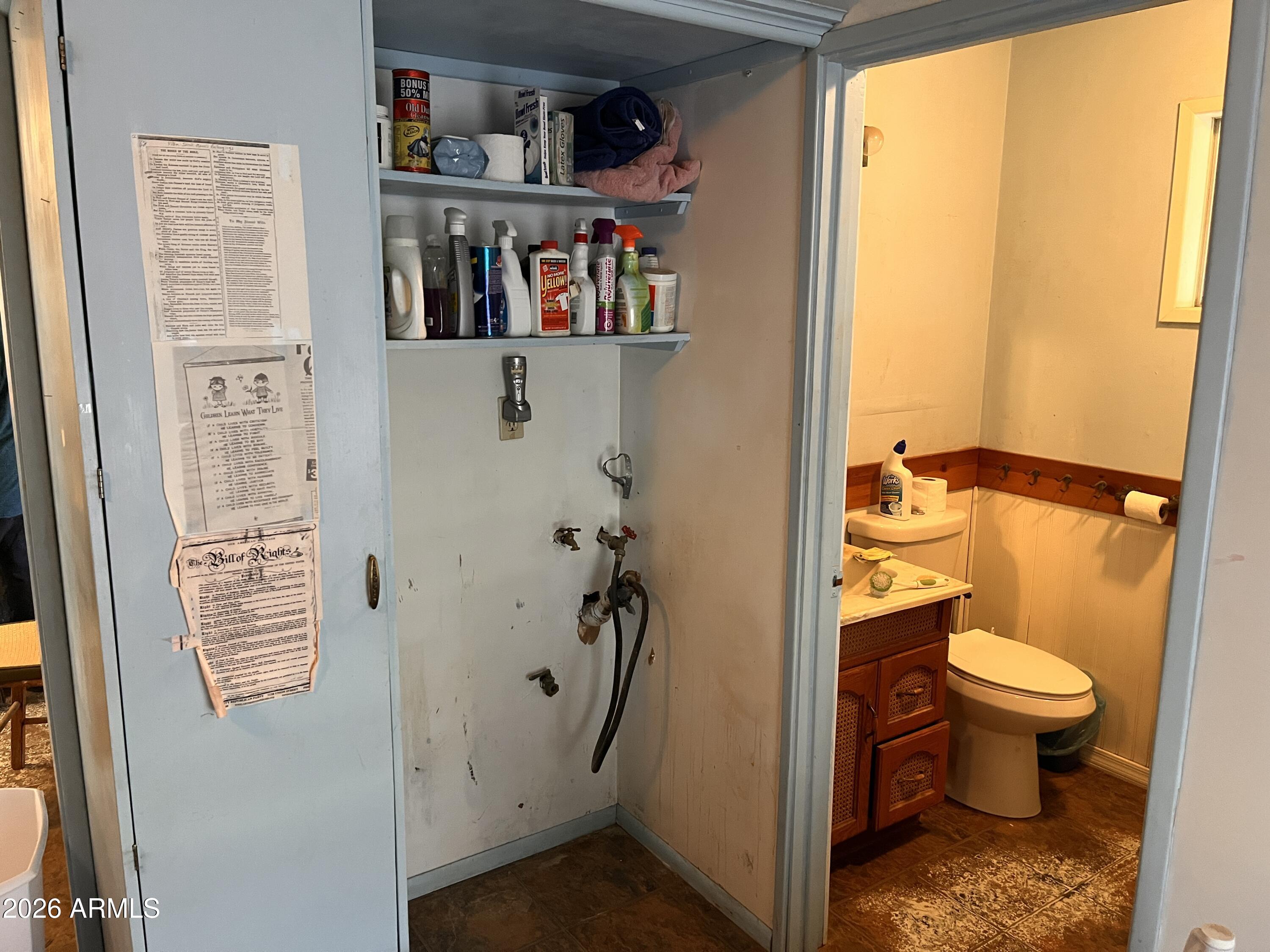 3140 Iron Springs Road Skull Valley, AZ 86338 - Photo 10 of 37 a view of bathroom with a toilet and a book shelf