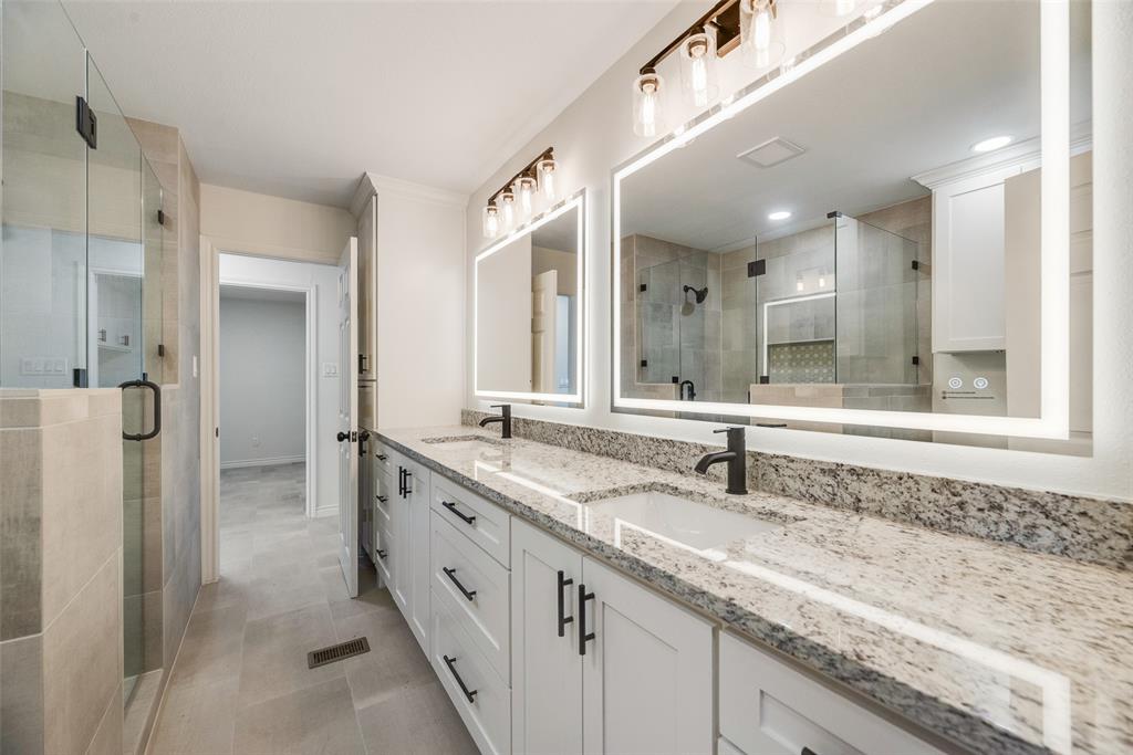2720 Seeton Road Grand Prairie, TX 75054 - Photo 17 of 31 a bathroom with a granite countertop sink and a mirror