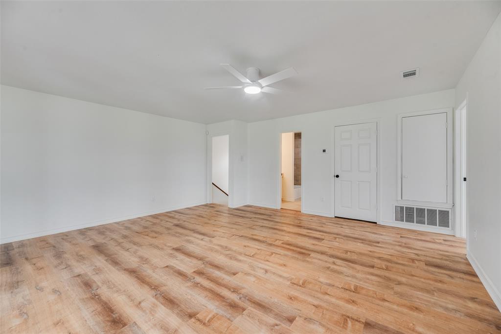 2720 Seeton Road Grand Prairie, TX 75054 - Photo 21 of 31 a view of empty room with wooden floor and fan