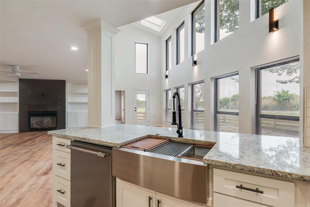 2720 Seeton Road Grand Prairie, TX 75054 - Photo 8 of 31 a kitchen with stainless steel appliances granite countertop a stove and a sink