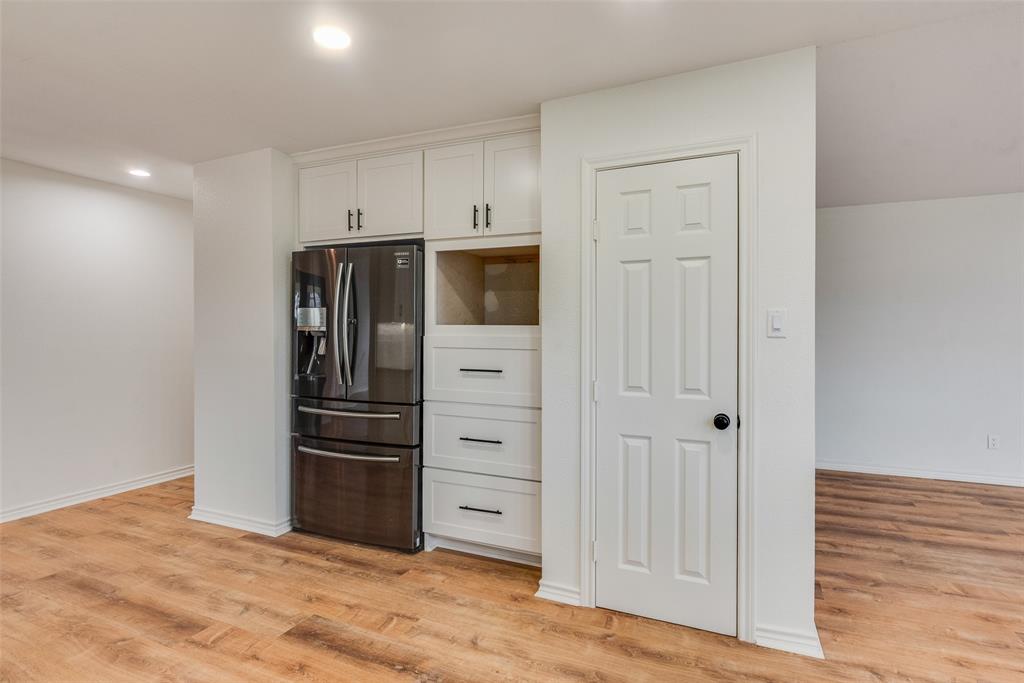 2720 Seeton Road Grand Prairie, TX 75054 - Photo 9 of 31 a metallic refrigerator freezer sitting in a kitchen