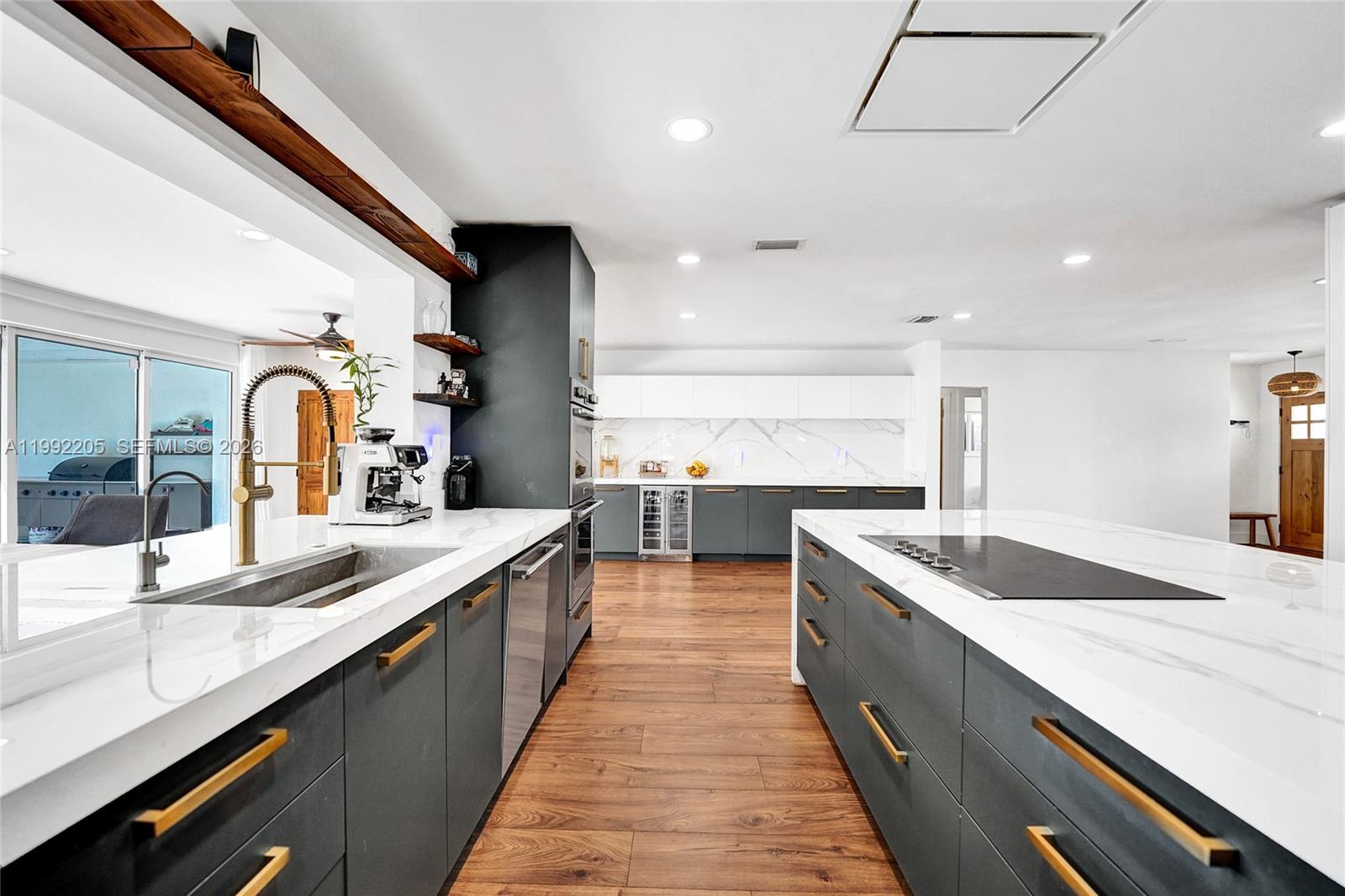 3350 North 40th Street Hollywood, FL 33021 - Photo 24 of 100 a large kitchen with stainless steel appliances lots of counter space and a sink
