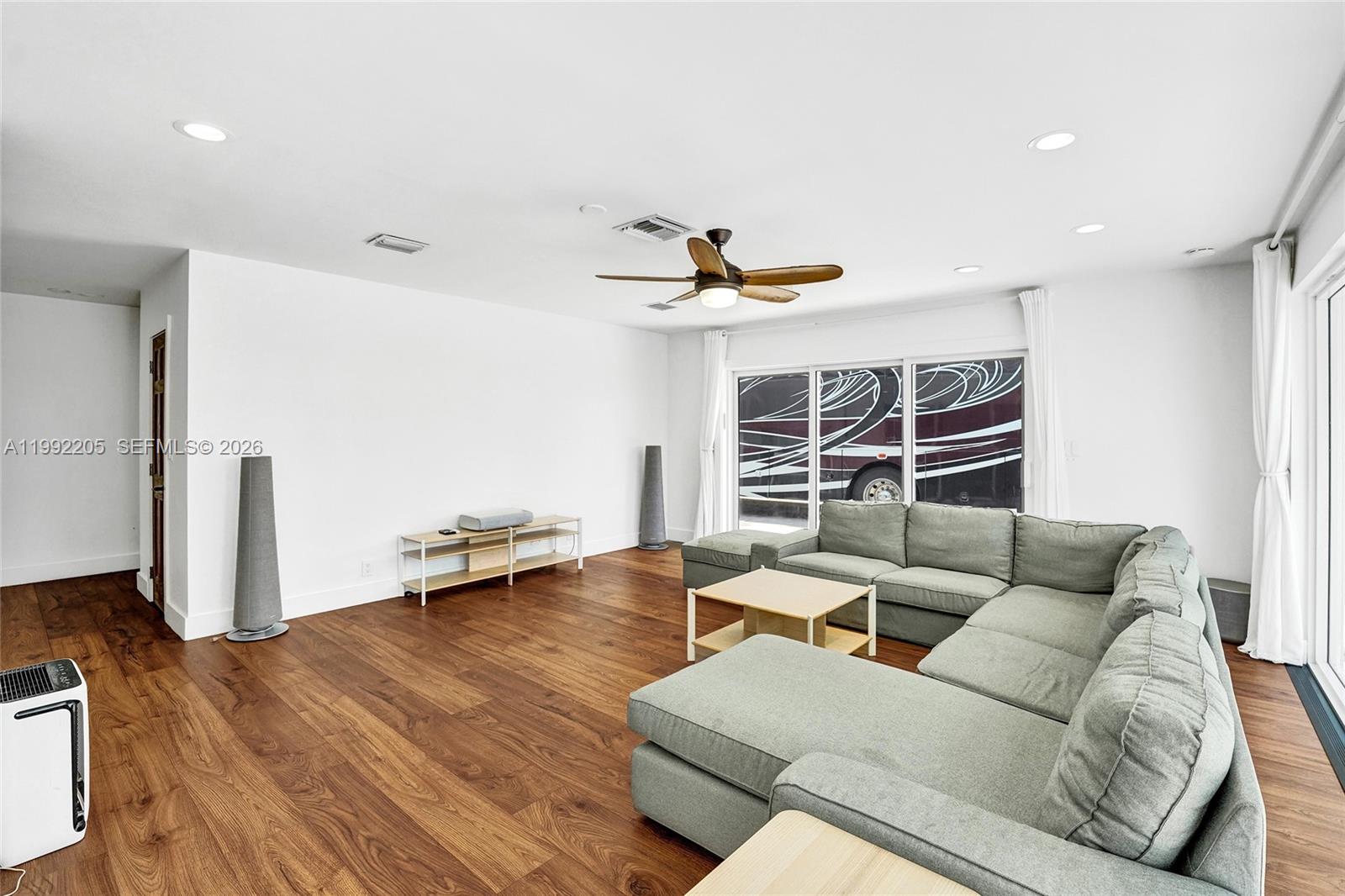 3350 North 40th Street Hollywood, FL 33021 - Photo 36 of 100 a living room with furniture and a flat screen tv