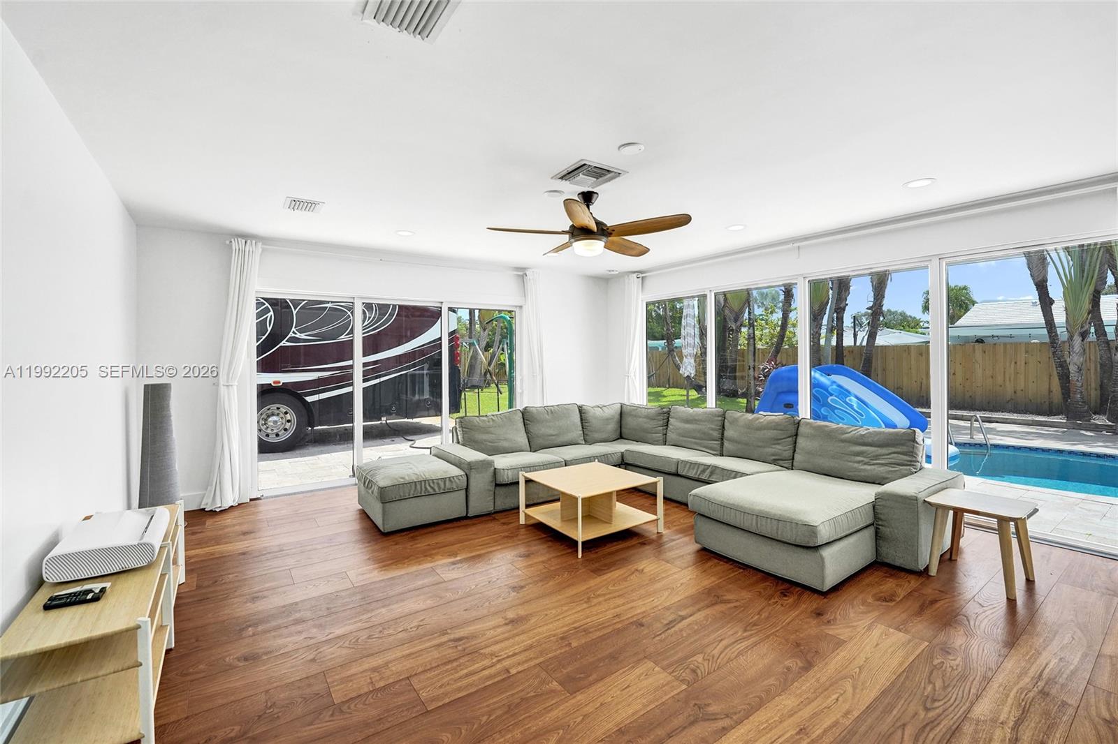 3350 North 40th Street Hollywood, FL 33021 - Photo 37 of 100 a living room with furniture and a large window