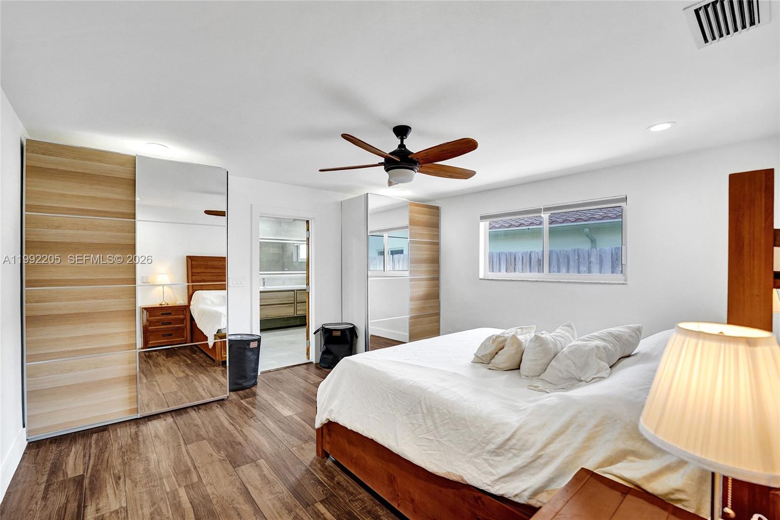3350 North 40th Street Hollywood, FL 33021 - Photo 45 of 100 a bedroom with a bed and wooden floor