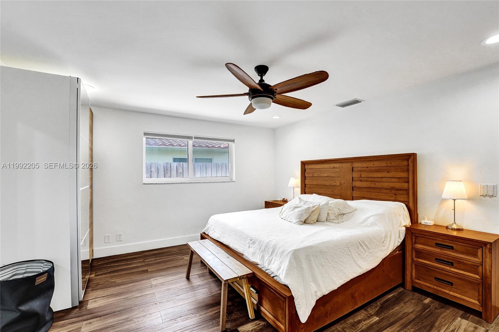 3350 North 40th Street Hollywood, FL 33021 - Photo 46 of 100 a bedroom with a bed and a chandelier