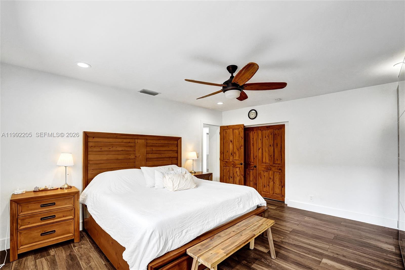 3350 North 40th Street Hollywood, FL 33021 - Photo 47 of 100 a bedroom with a bed and wooden floor
