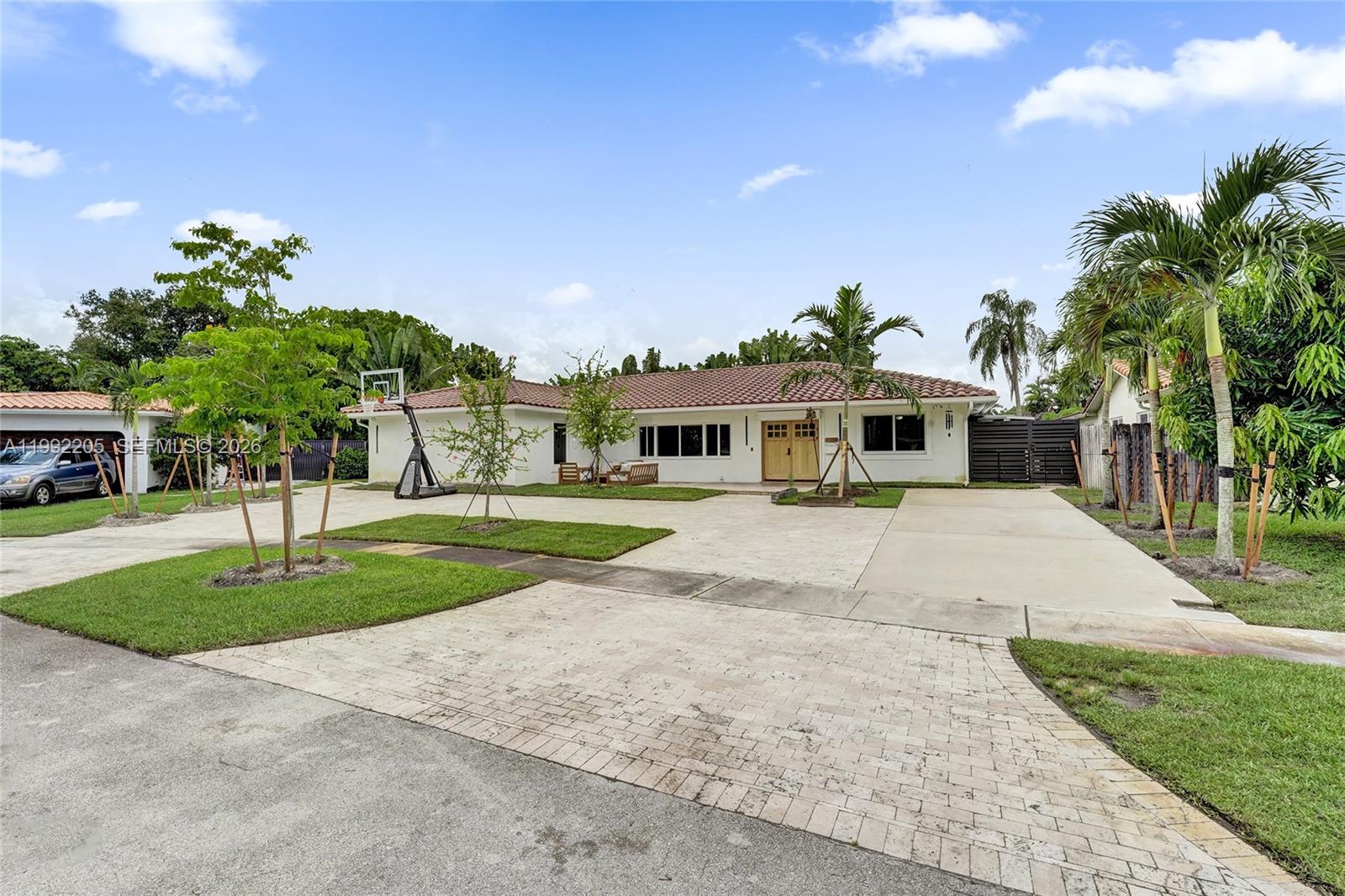 3350 North 40th Street Hollywood, FL 33021 - Photo 5 of 100 a front view of a house with a yard and potted plants