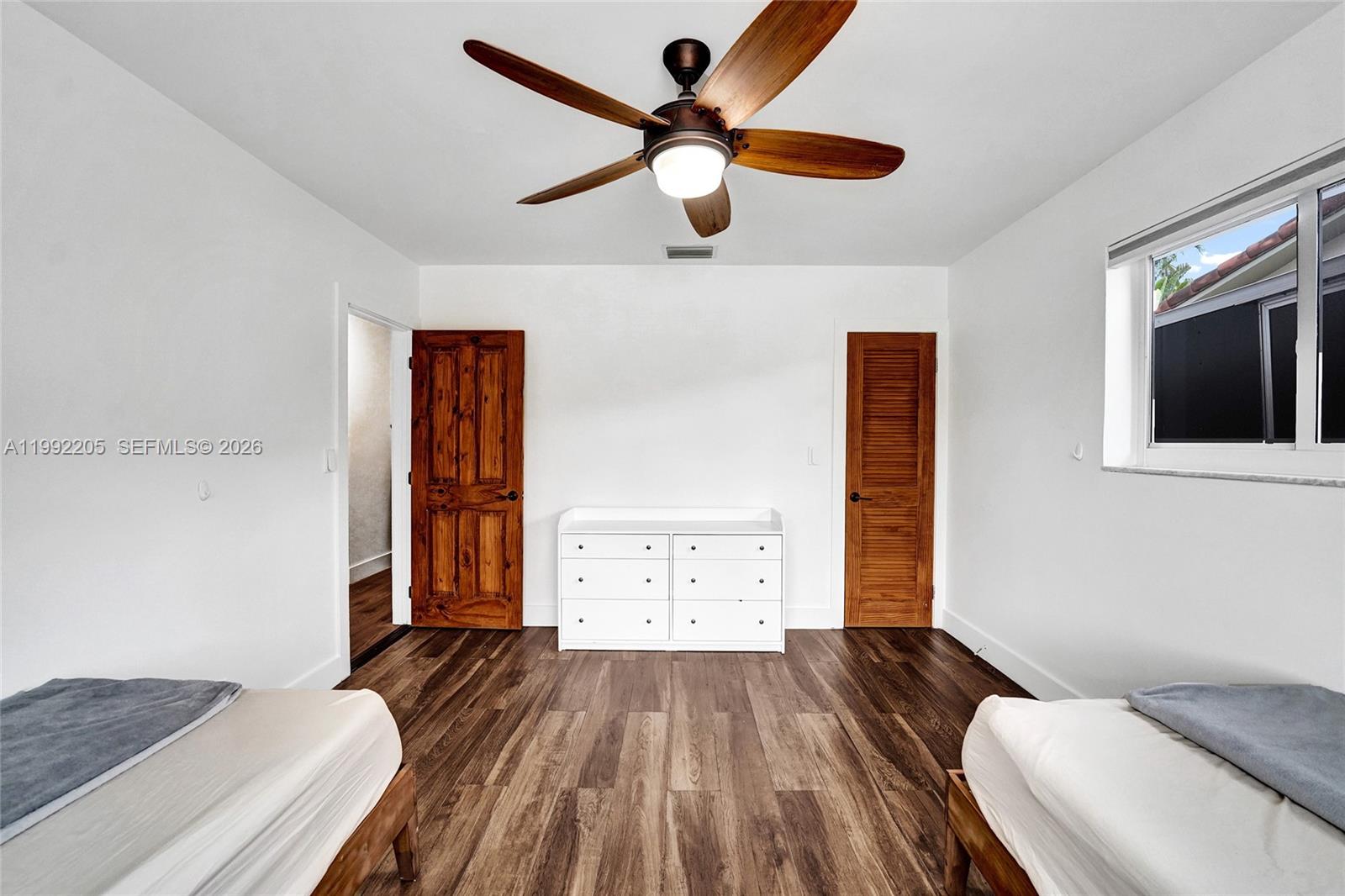3350 North 40th Street Hollywood, FL 33021 - Photo 57 of 100 a bedroom with a bed and a flat screen tv