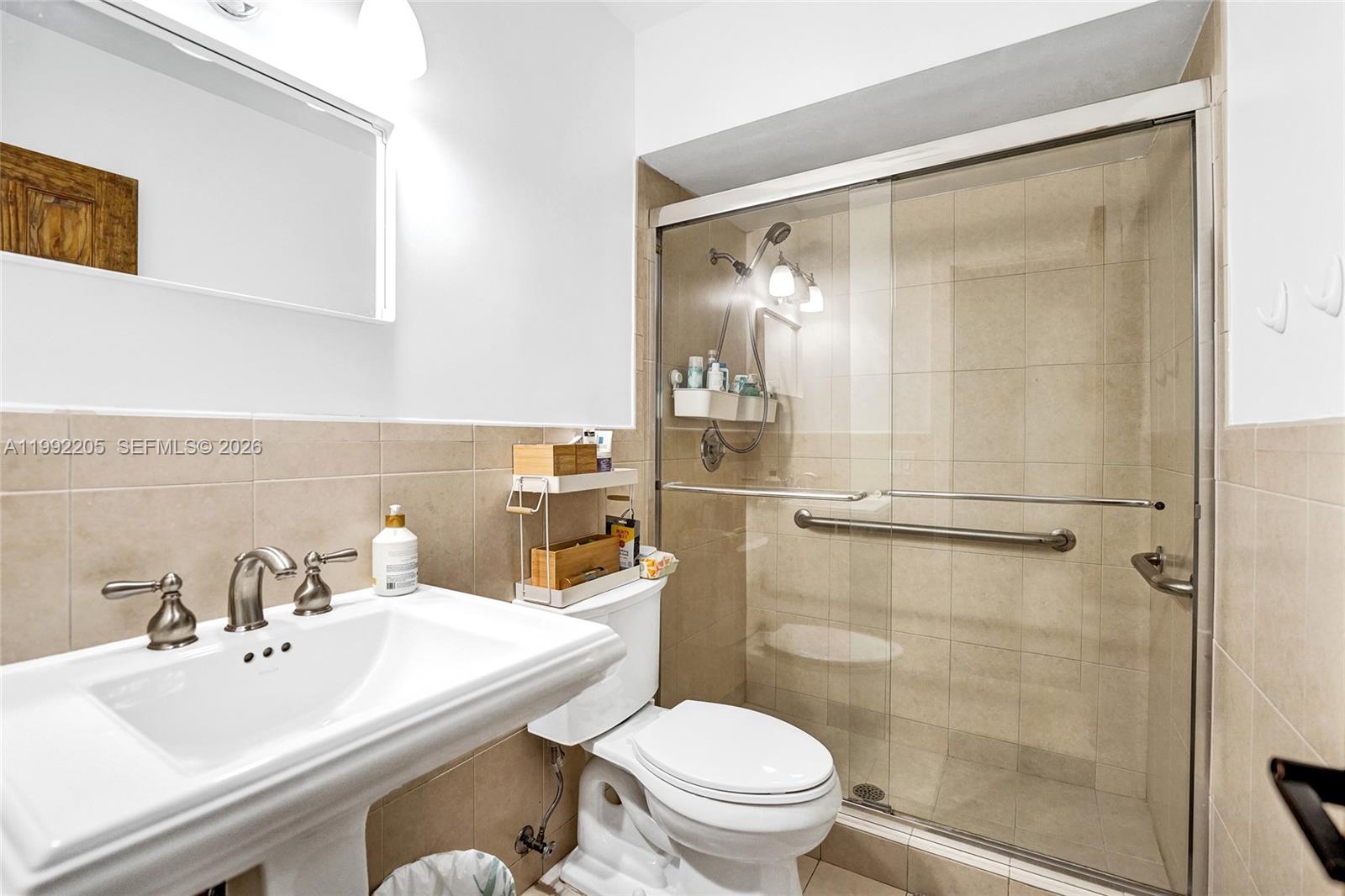 3350 North 40th Street Hollywood, FL 33021 - Photo 60 of 100 a bathroom with a sink toilet and shower