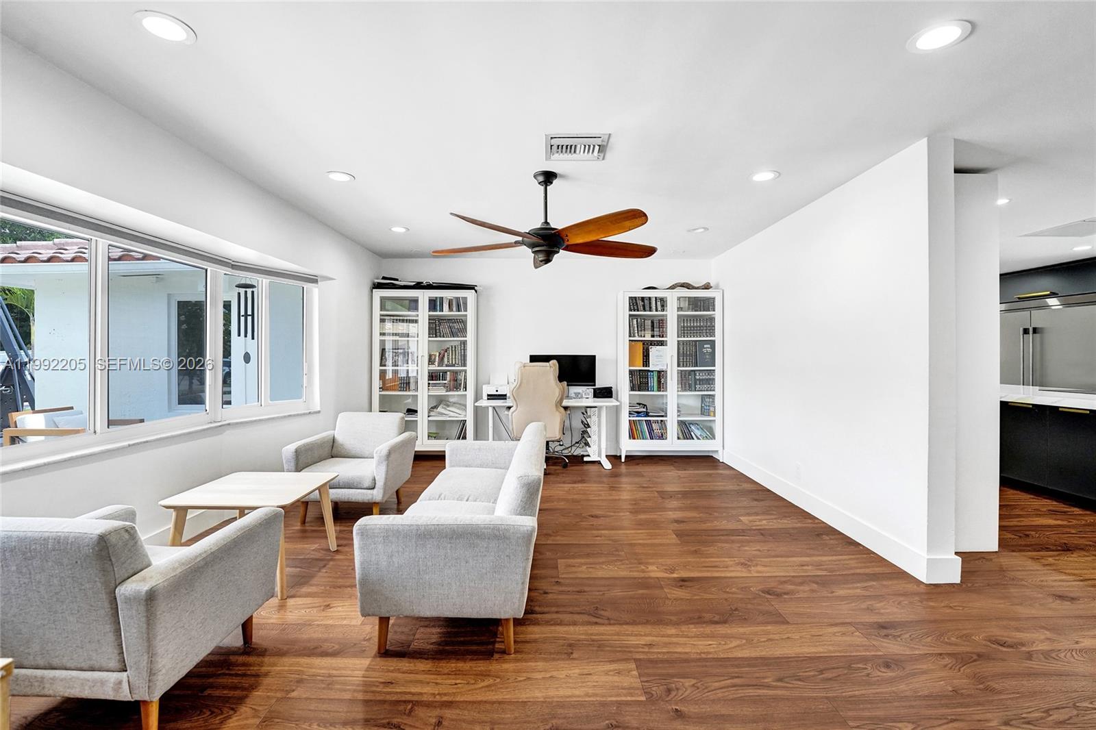 3350 North 40th Street Hollywood, FL 33021 - Photo 71 of 100 a living room with fireplace furniture and a wooden floor