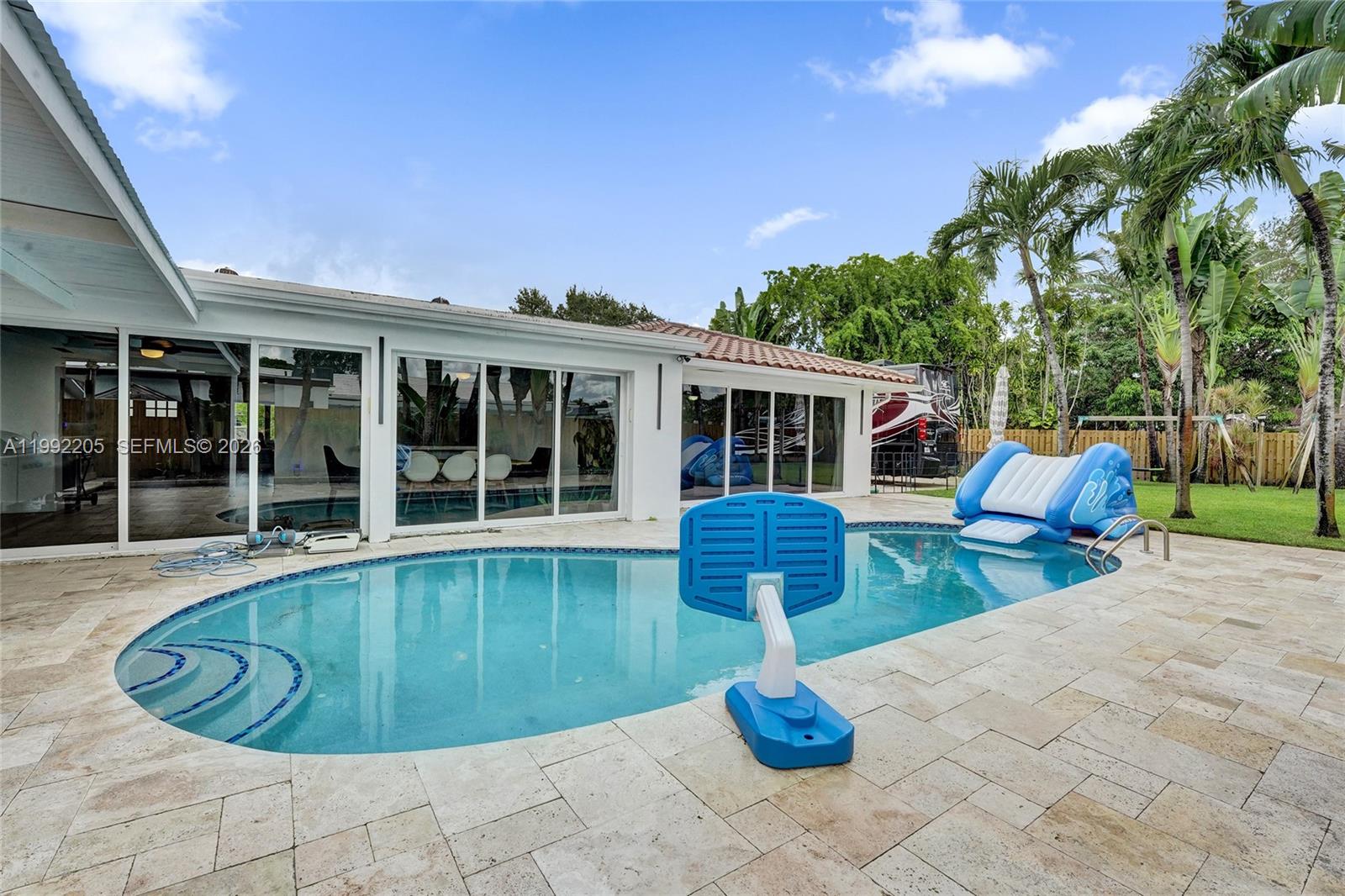 3350 North 40th Street Hollywood, FL 33021 - Photo 92 of 100 a view of a house with swimming pool and sitting area