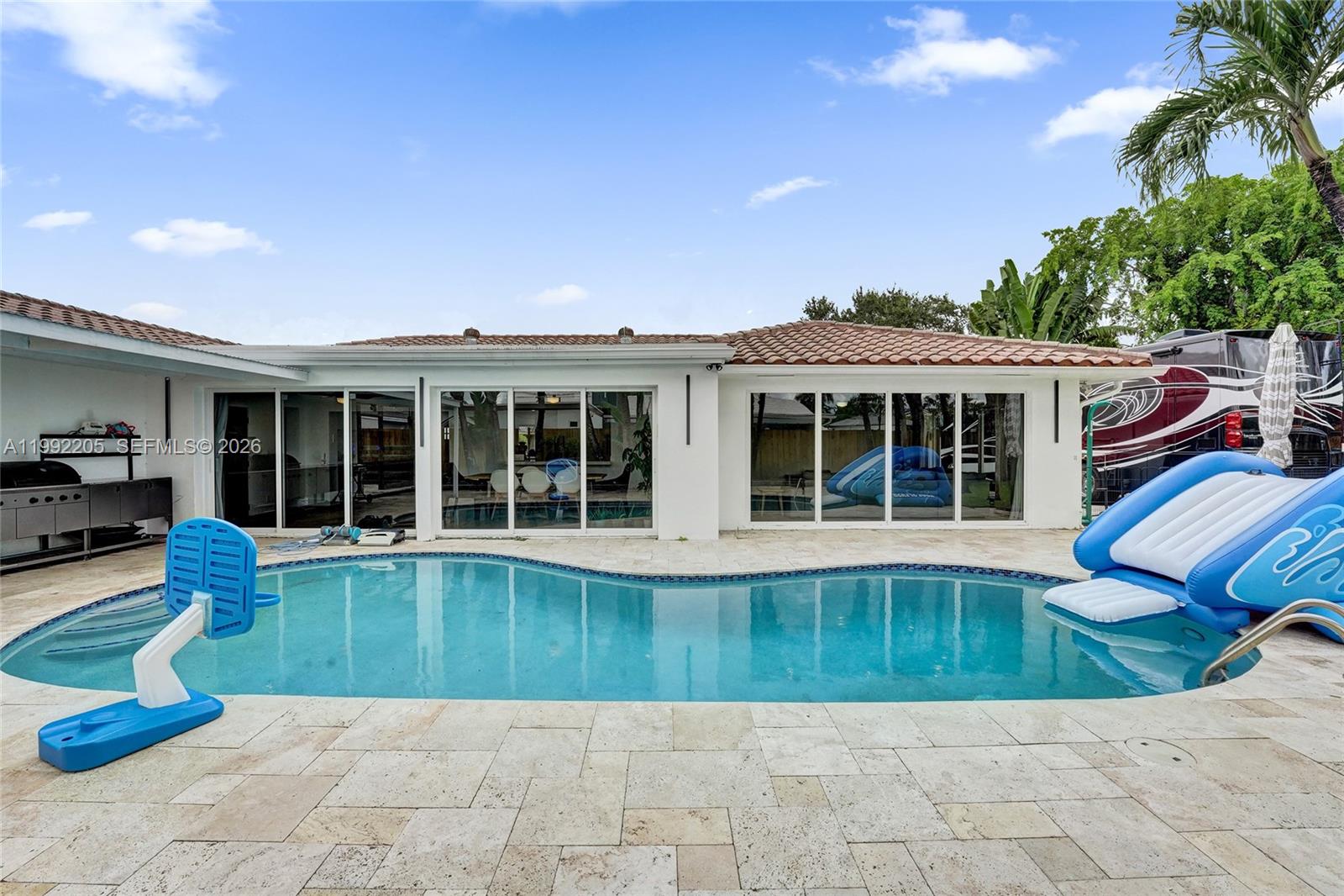 3350 North 40th Street Hollywood, FL 33021 - Photo 93 of 100 a view of a house with swimming pool and sitting area