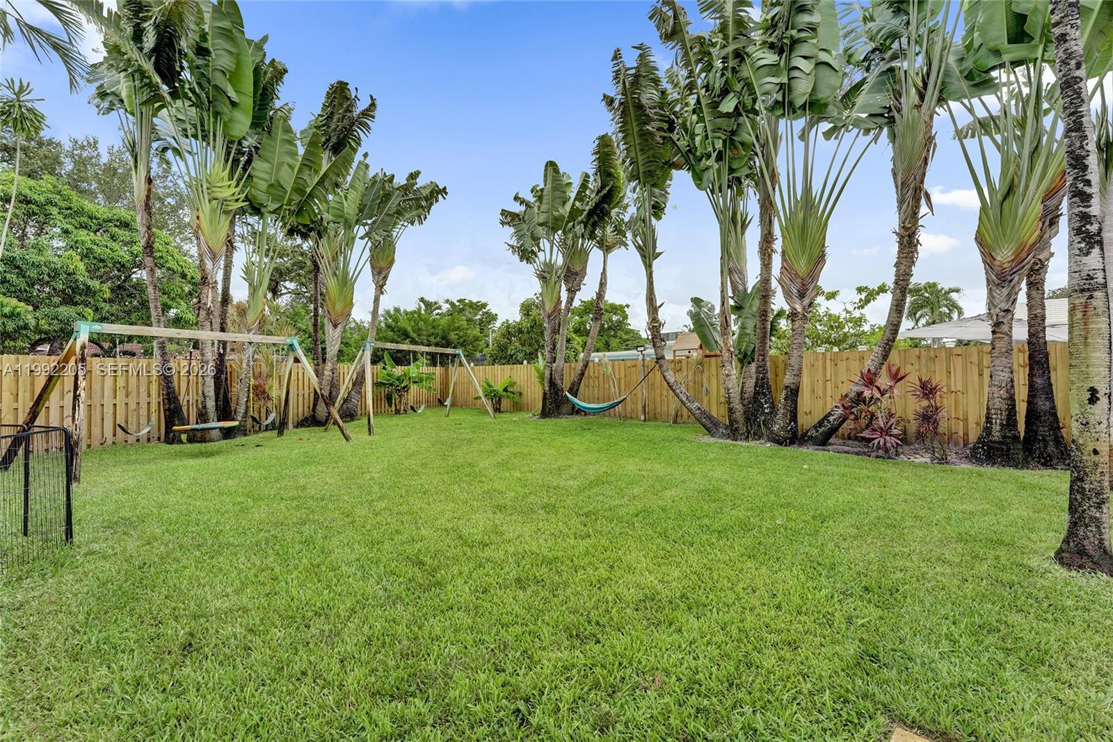 3350 North 40th Street Hollywood, FL 33021 - Photo 95 of 100 a view of a backyard with large trees