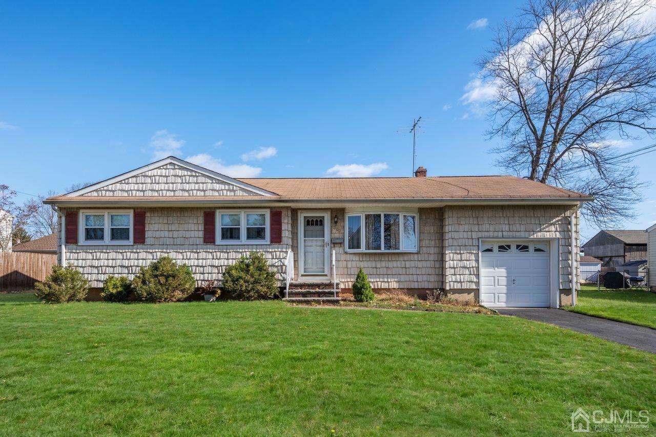 300 Main Street Middlesex, NJ 08846 - Photo 1 of 17 a front view of a house with garden