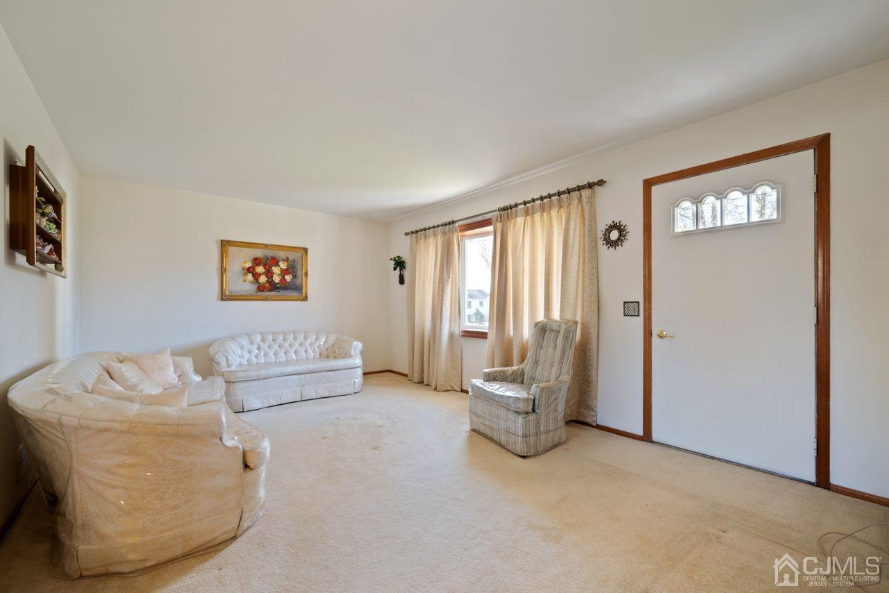 300 Main Street Middlesex, NJ 08846 - Photo 3 of 17 a living room with furniture and a window
